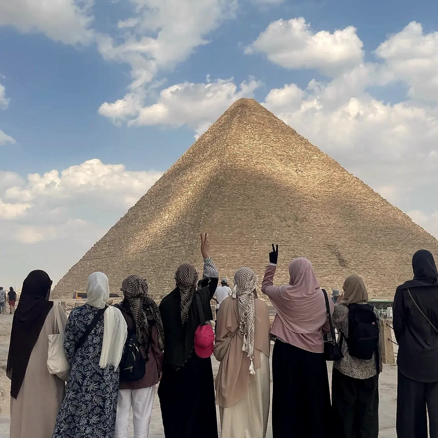 Sisters looking up at the Great Pyramid
